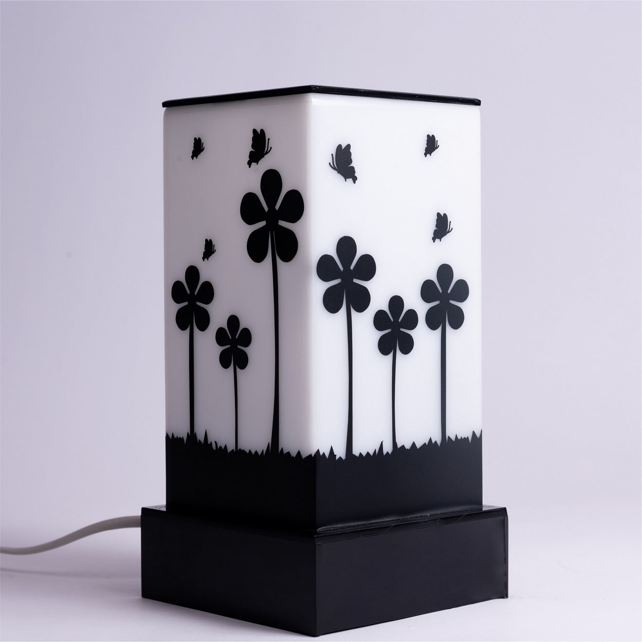 Lamp that celebrates nature flowers and butterflies