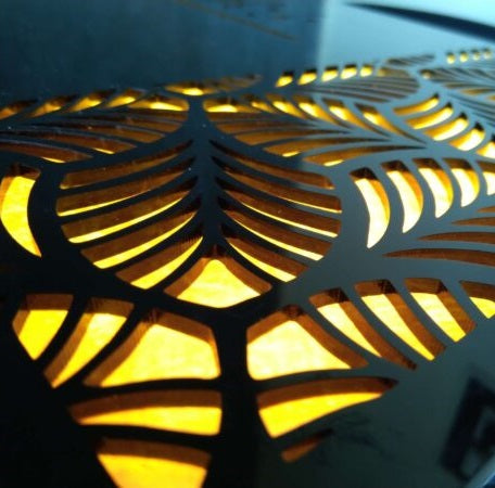 an image showing the depth of a laser cutting on a name plate with light