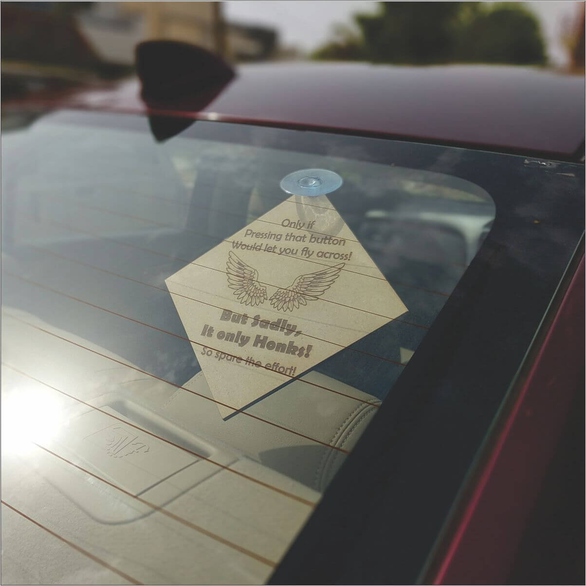 No Honking car accessory for rear glass.