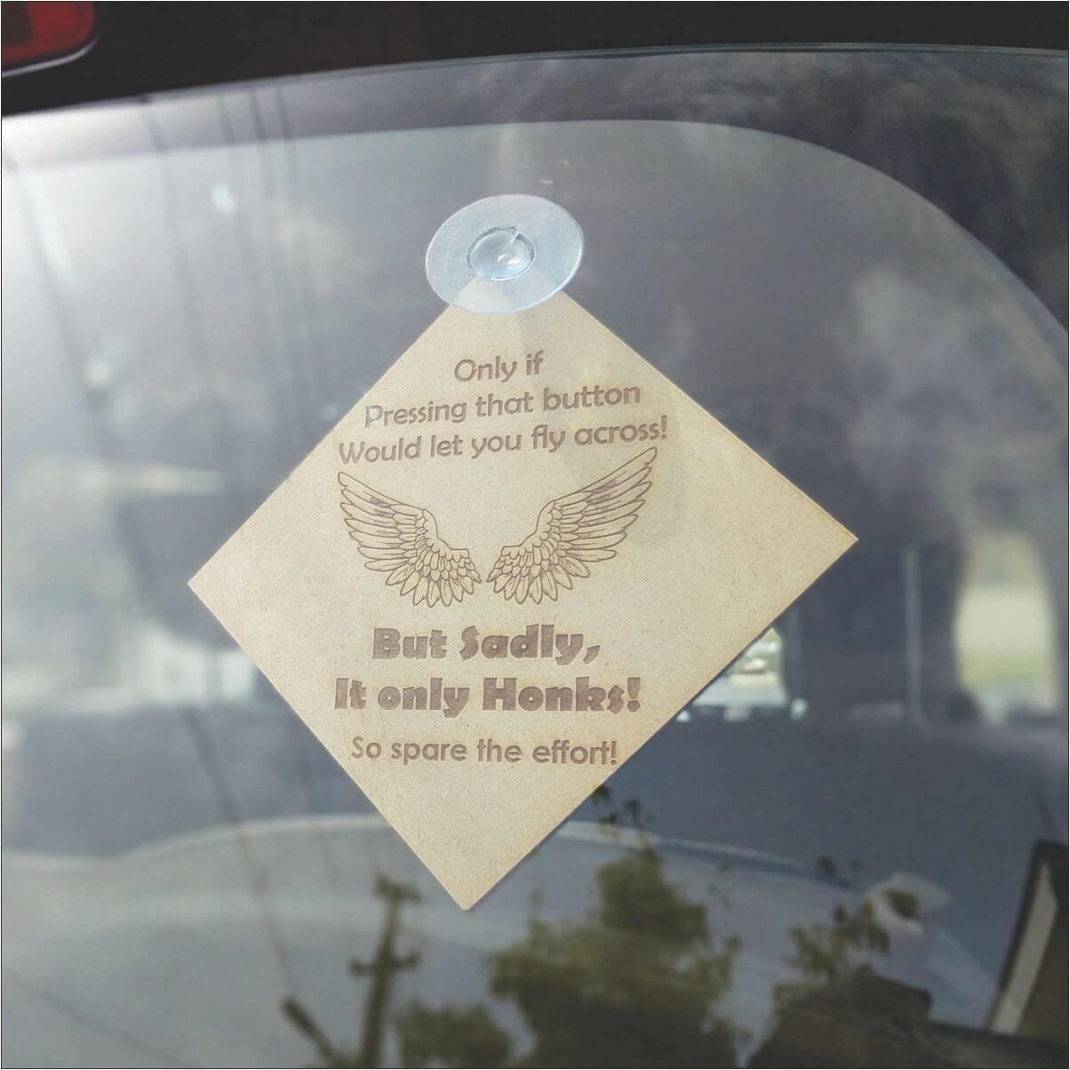 No Honking car accessory for rear glass.