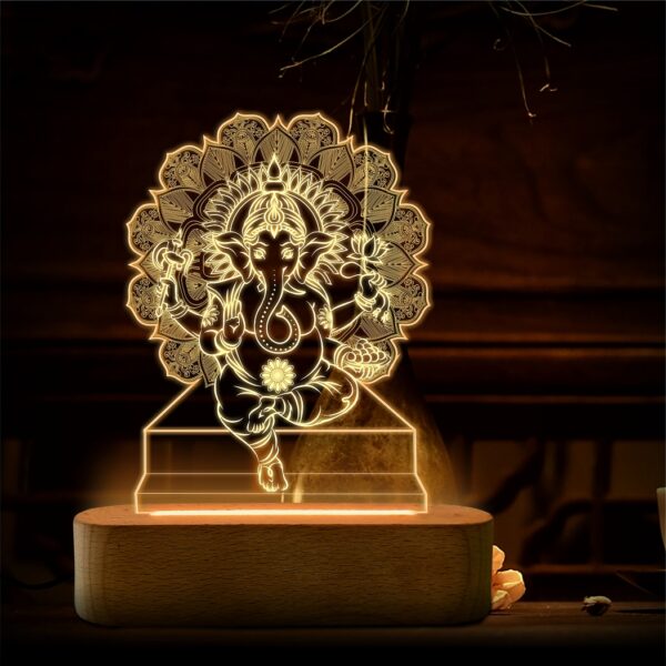 lamp with an engraved image of lord ganesha